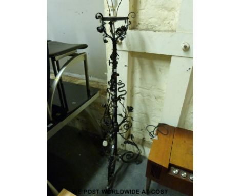 A floral metal standard lamp in the manner of Benson, with height adjustment