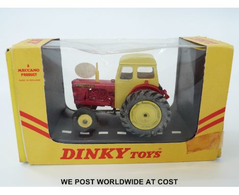 Dinky Toys diecast model David Brown Tractor 305, with yellow cab, exhaust and hubs, red engine cover, rear attachment and mu