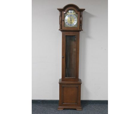 An oak cased Tempus Fugit longcase clock with weights and pendulum 