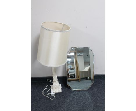 An early twentieth century frameless mirror together with a chalk table lamp with shade 