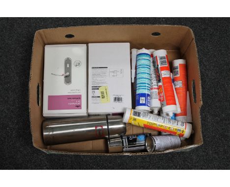 A box of brass door handles, sealants, flask, spray paint etc 