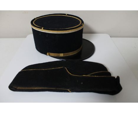 A vintage French police hat together with an early 20th century military hat 