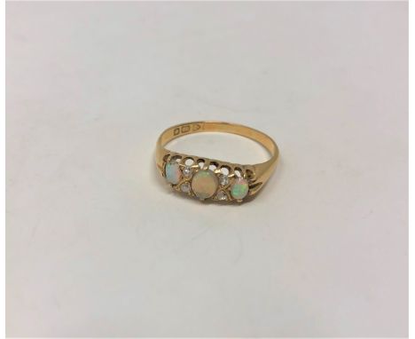 A Victorian 18ct gold opal and diamond ring, size S CONDITION REPORT: 3.2g