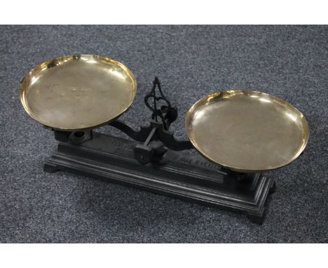 A set of antique cast iron pan scales 