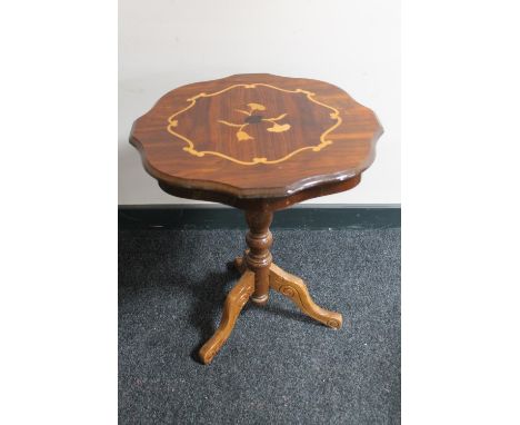 An Italianate pedestal wine table 