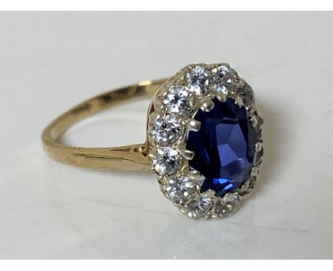 A 9ct gold synthetic sapphire cluster ring, size P1/2 CONDITION REPORT: 3.3g