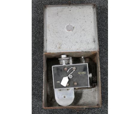 A vintage tin marked Hexham, containing transport ticket machine 