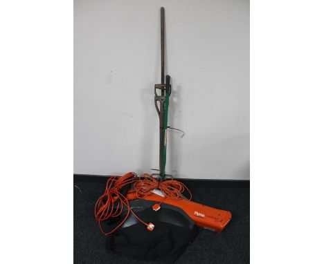 A Flymo garden vacuum together with a bundle of garden tools 