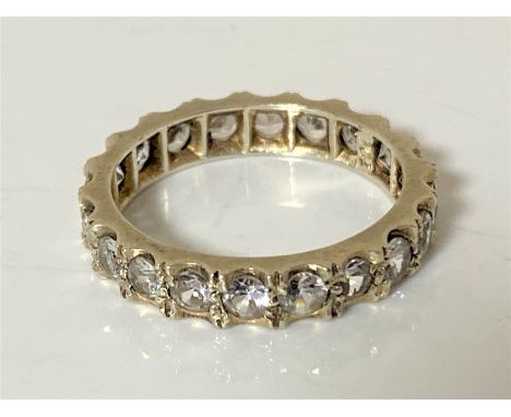 A 9ct gold white sapphire eternity ring, size P1/2 CONDITION REPORT: 3.5g