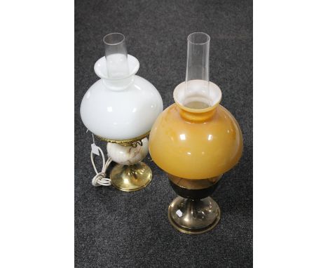 A brass Aladdin oil lamp with glass shade and chimney together with a further brass and marble oil lamp