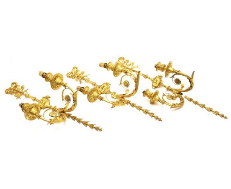 A set of three 19th century and later gilt glass gesso wall lights, together with a similar gilt metal example and a chandeli