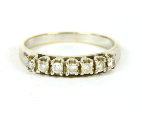 A white gold seven stone diamond ring, marked 750, 2.90g