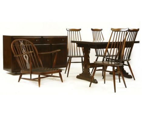 An Ercol Windsor sideboard, 136cm wide, 46cm deep, 81cm high, four Goldsmith chairs a similar easy chair, and a refectory tab