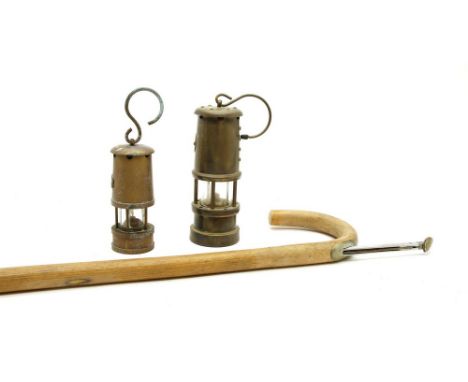 A horse measuring stick, with concealed slide up scale rod, and two small brass miners lamps (3)