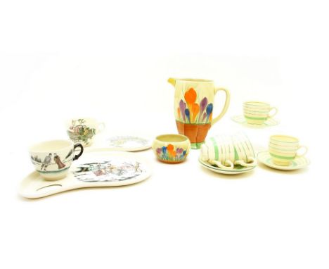 Clarice Cliff ceramics : a crocus pattern jug, 18cm high, a bowl, 5.5cm high, four green and silver banded cups and saucers, 