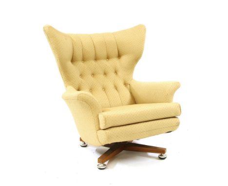 A mid century G-Plan button backed easy chair