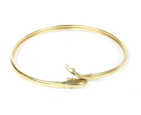 A 9ct gold slave bangle, with dolphin head and tail finial, 6.09g and an Italian 18ct gold Prince of Wales bracelet, 2.61g