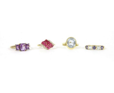 Four assorted rings, to include a 9ct gold ruby and diamond cluster ring, 2.75g, an Italian gold single stone synthetic spine