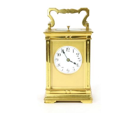 An early 20th century carriage clock, the white enamel dial with Arabic numerals and gong strike movement with repeat push bu