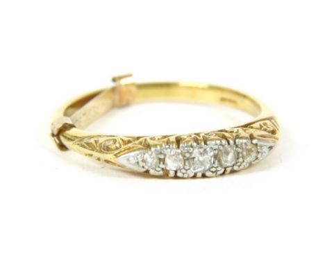 A gold five stone graduated diamond ring, marked 18ct, 3.43g