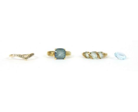 A gold single stone mystic topaz ring, 2.41g, a 9ct gold diamond set half wishbone, 1.27g, and a 9ct gold three stone ring, 2