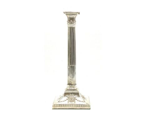 A silver plated Corinthian column form candlestick, on swept square base with husk and swag detail