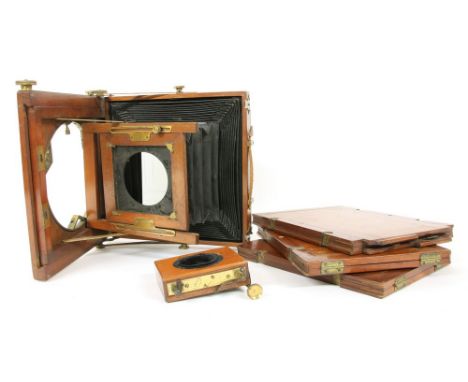 A mahogany brass plate camera by J.Kershaw, together with three cased plates, lens missing