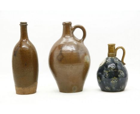 A Royal Doulton stoneware whisky flagon, 'Mackinlay Very Old Scotch Whisky', 29cm, and two French stoneware wine flagons, 32 