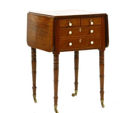 A Victorian mahogany drop flap work table, with box wood inlaid line decoration with ivory drawer pulls, on ring turned legs,