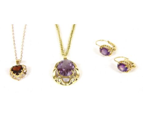 A single stone amethyst pendant, in a pierced frame on chain marked 333, and a pair of matched single stone amethyst earrings
