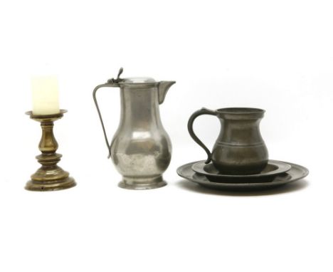 A brass pricket candlestick, drilled, 17th century, a pewter coffee pot, 19th century, 24cm, a pewter quart tankard, 16cm and