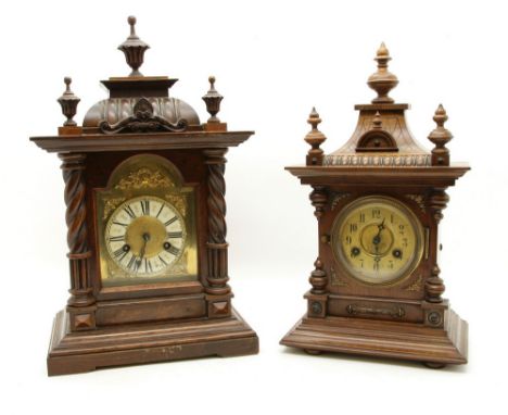 A Victorian oak mantel clock, the eight day movement striking a bell, 50cm high, together with a further similar, 45cm high