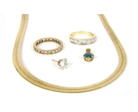 An Italian cobra link necklace, 8.84g, a gold cubic zirconia half eternity ring, 2.60g, a single gold cubic zirconia stud, 0.