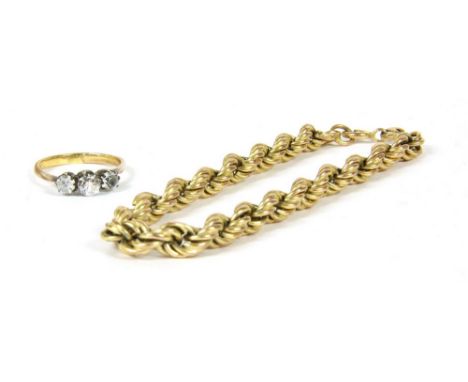 A 9ct gold rope link bracelet, 6.15g, and a three stone paste ring tested as approximately 9ct gold 2.35g