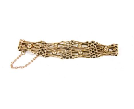 A gold four row crossover gate link bracelet, with beads to the centre and concealed box link clasp, 10.37g