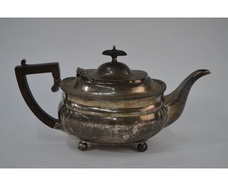 A Regency-style silver teapot with composition finial and handle, on ball feet, C. S. Harris &amp; Sons Ltd., London 1919, 18