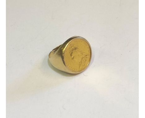 A yellow gold ring stamped 9ct enclosing an 1890 gold sovereign, size Y, approx 17.3g all in