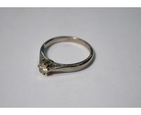 An 18ct white gold ring set with single claw set brilliant cut diamond, approx 0.25 carats, size O, approx 3.1g all in