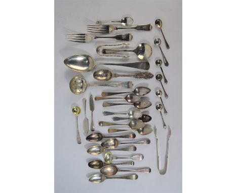 An OEP silver sifter ladle of Georgian origin, with engraved stem and bowl, to/w various other Georgian and later spoons and 