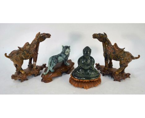 Four Chinese carved hardstone figures on wooden stands including a pair of russet saddled horses standing four square, 12 cm,
