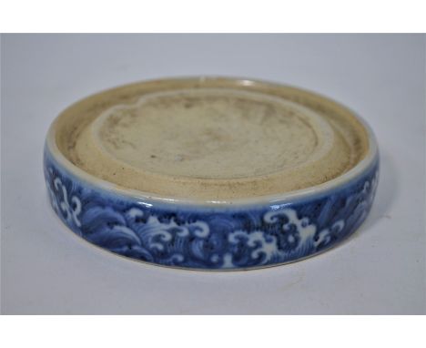 A 19th century Chinese blue and white porcelain ink stand, the base with six character Xuande mark, 12 cm diameterseveral gla