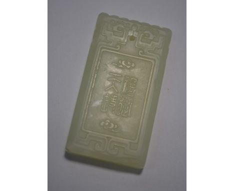 A Chinese celadon jade rectangular pendant, one side worked with a boy watching a flying bat, the other with four character z