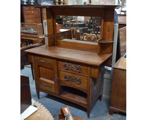 An Arts &amp; Crafts oak mirror backed sideboard, designed by Harris Lebus circa 1901, with inlaid panels over and arrangemen