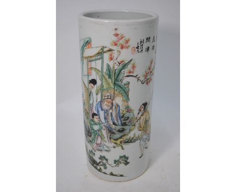 A Chinese Republic period famille rose porcelain hat stand of cylindrical form, painted with a narrative scene and calligraph