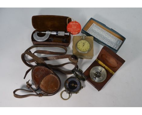 A teak-cased pocket compass with silvered dial, to/w a World War One lacquered brass bearing compass with mother-of-pearl dia