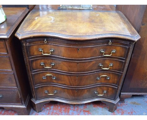 Edwardian cross-banded mahogany serpentine form chest of four long graduated drawers with brass swan-neck handles beneath a f