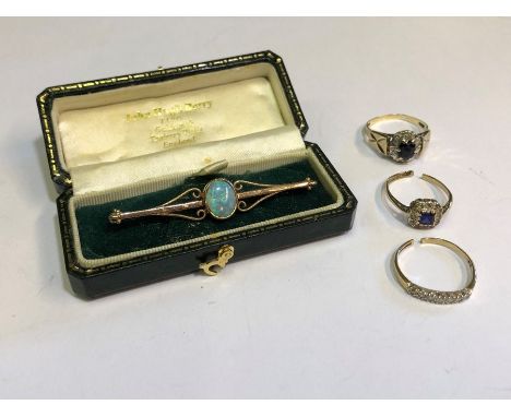 An Arts and Crafts style 9ct yellow gold bar brooch with central oval opal to/w three various diamond set rings (all a/f)