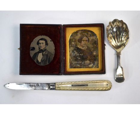 A Victorian fiddle pattern silver caddy spoon with shell bowl, Francis Ponter, London 1843, a penknife with carved mother-of-