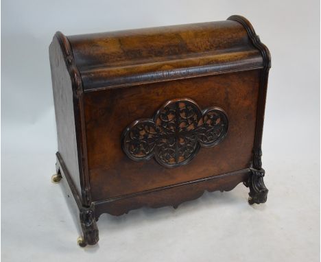 A 19th century burr walnut dome top cellarette / canterbury box, with fret cut panels and raised on moulded feet to ceramic c