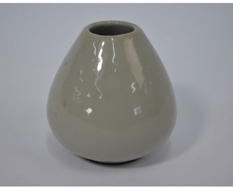 A Chinese ceramic water pot of lotus bud form, covered inside and out, excluding the foot rim, with a plain pale grey opaque 